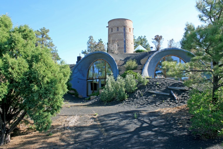 An asterisk-shaped home with an Anasazi-style tower
