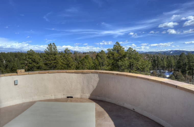 An asterisk-shaped home with an Anasazi-style tower