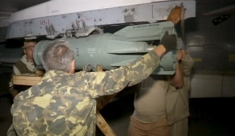 Image: Frame grab shows technicians servicing a Russian military jet in Syria