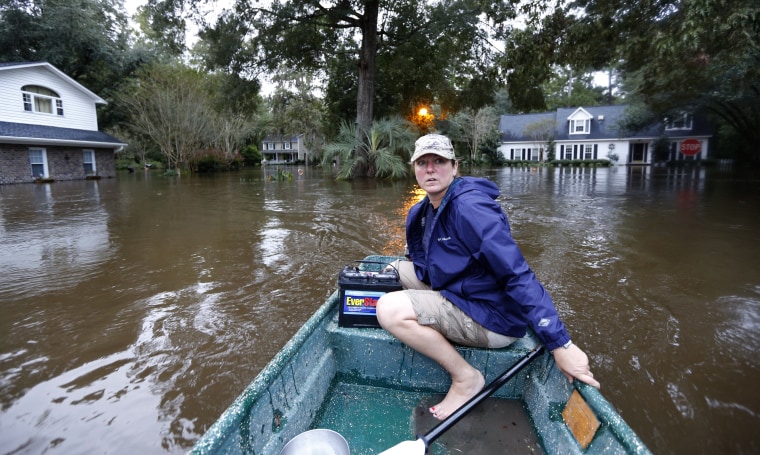 Image: South Carolina woman checks on flooded neighbors