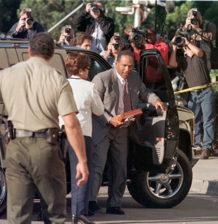 Defendant O.J. Simpson arrives under the gaze of t