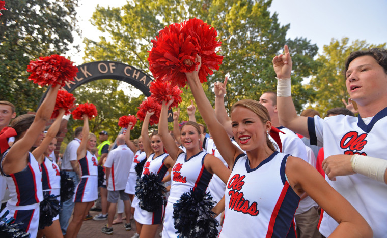 Image: University of Mississippi cheerleaders cheer before a football game