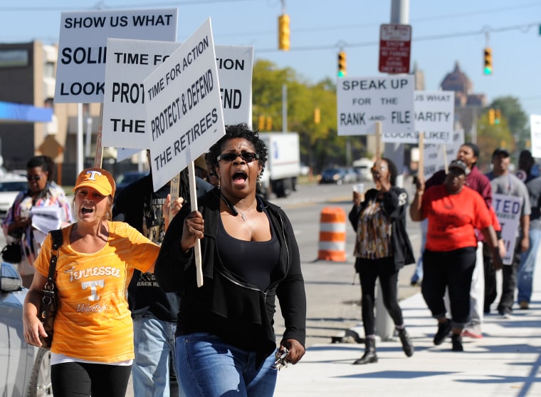 Image: Protesters picket outside UAW Solidarity House