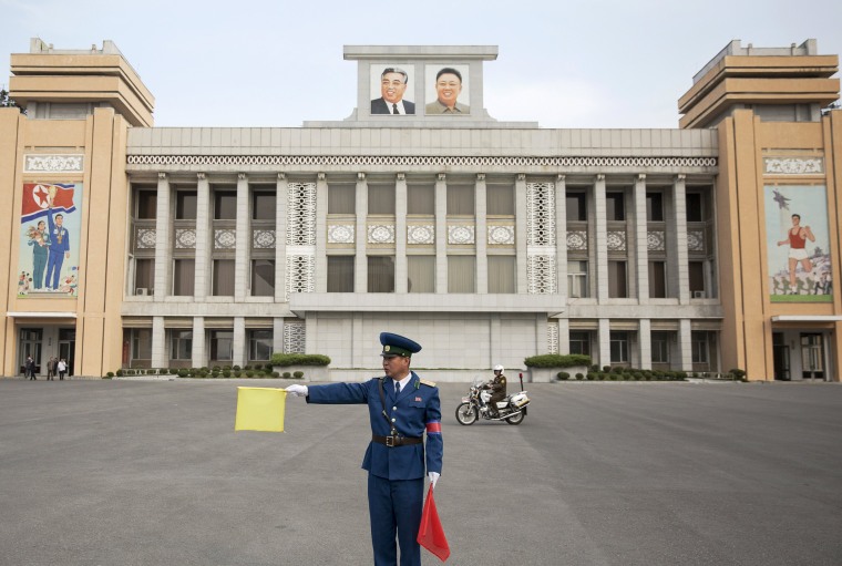 Image: A policeman directs traffic at Kim Il Sung Stadium before North Korea's preliminary 2018 World Cup and 2019 AFC Asian Cup qualifying soccer match against Philippines in Pyongyang