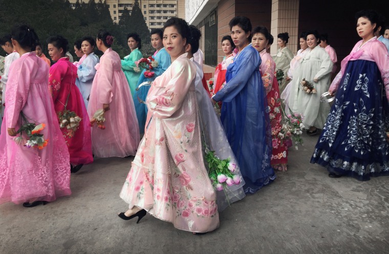 Image: Women rehearse for the 70th anniversary of the founding of North Korea's Communist party