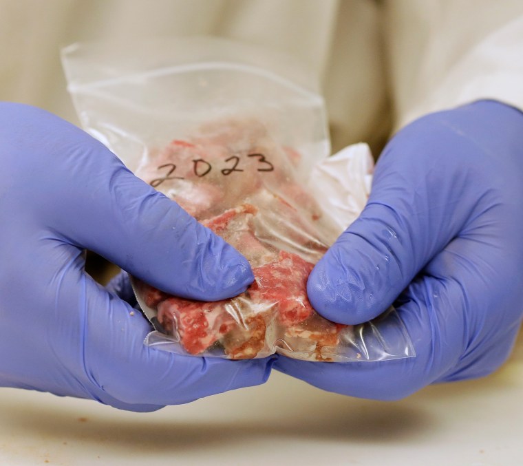 Image: Meat scientist  Bob Danler prepares a sample of ground beef for testing