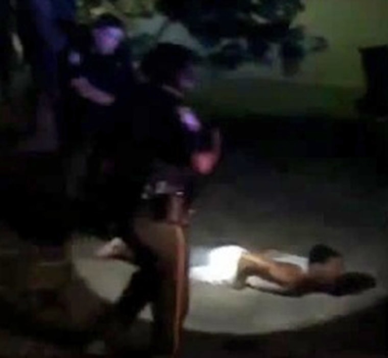 Prairie View city councilman Jonathan Miller is tasered by police in front of his home in this still from a cellphone video.