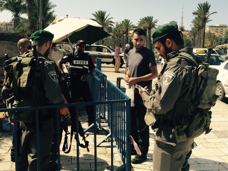 Image: Israeli security forces check ID cards at Damascus Gate in Jerusalem