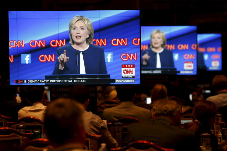 Image: Democratic U.S. presidential candidate and former Secretary of State Hillary Clinton appears on television screens in the press room at the first official Democratic candidates debate of the 2016 presidential campaign in Las Vegas