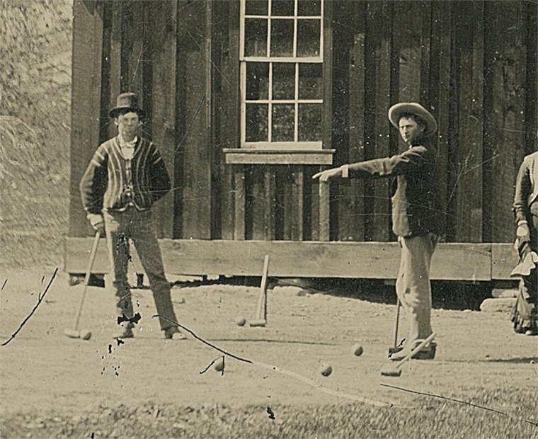 Image: Close-up of a newly discovered 4-by-5-inch tintype photograph shows legendary Wild West gunslinger Billy the Kid playing croquet with accomplices from his New Mexico gang known as the Regulators