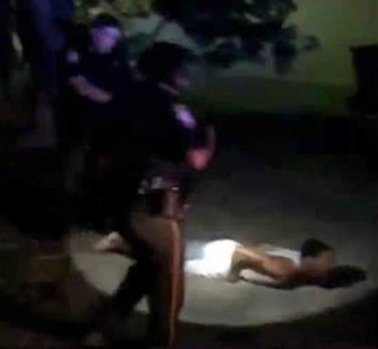 Prairie View city councilman Jonathan Miller is Tasered by police in front of his home in this still from a cellphone video.