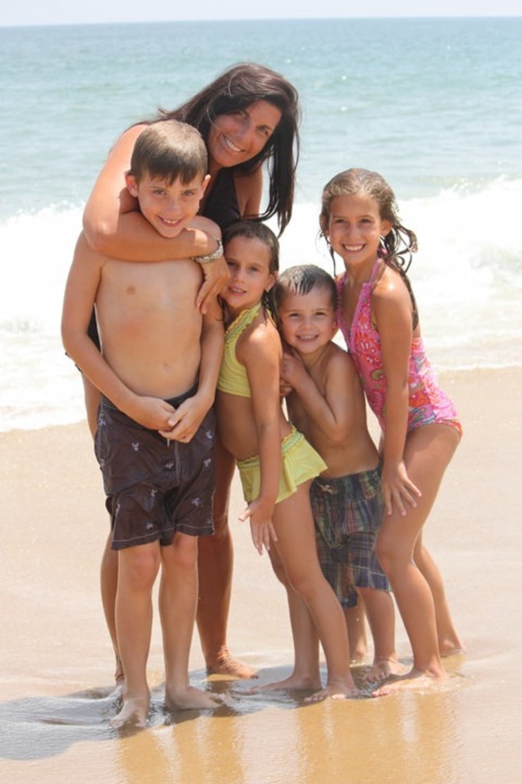 Amy Seventko shares a happy moment with her four kids shortly before her breast cancer diagnosis in 2011.