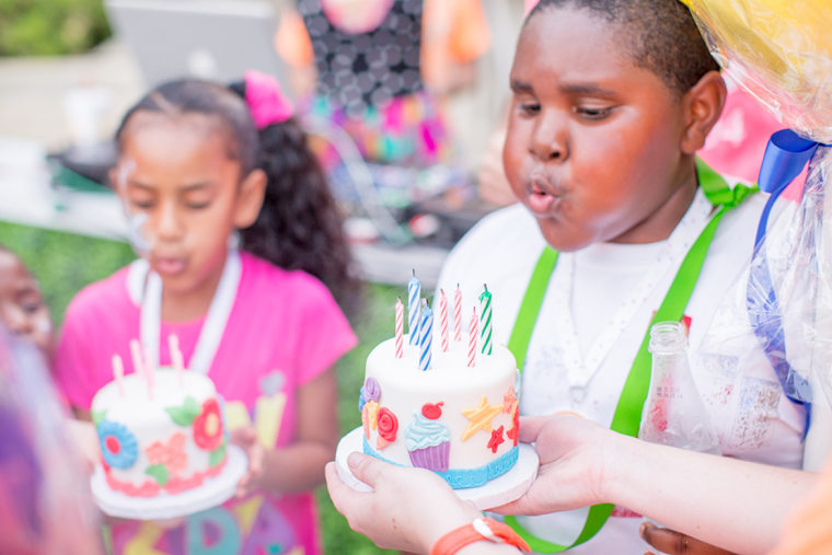 Homeless children blow out their birthday candles in Dallas.