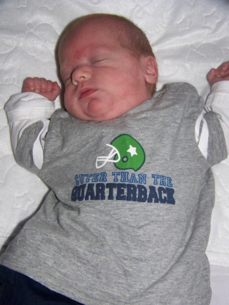 Baby sleeping in quarterback T-shirt