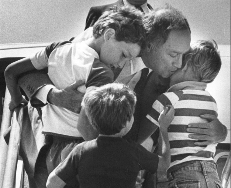 Image: File photo of Canada's Prime Minister Pierre Trudeau greeting his sons Justin, Sacha and Michel after returning home from a foreign trip in Ottawa
