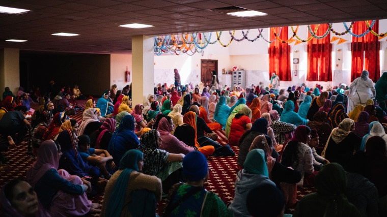 Sikh women pray in the large temple area at the Sikh Temple in Richmond Hill, Queens on Sunday, October 11th 2015.
