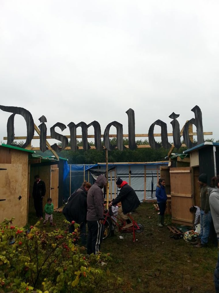 The "Dismaland" sign was altered to spell out "Dismal aid" — but it was later torn down.