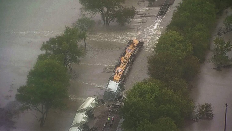 Image: A train overturned in floodwaters in Navarro County, Texas.
