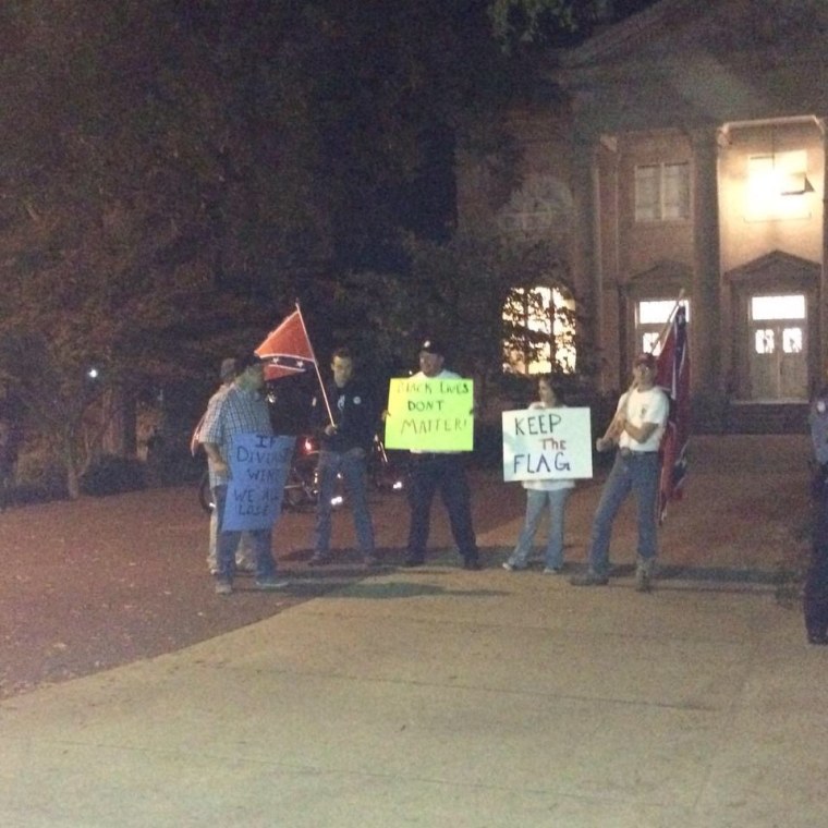 Protestors rallied on campus at Ole Miss to protest the vote to remove the confederate flag from campus, holding signs read, ‘Keep the Flag’, ‘Black Lives Don’t Matter’ and ‘If Diversity Wins, We All Lose’.