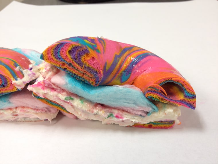 Cross Section of Rainbow Bagel Stuffed with Funfetti Cream Cheese and Cotton Candy from Brooklyn's The Bagel Store