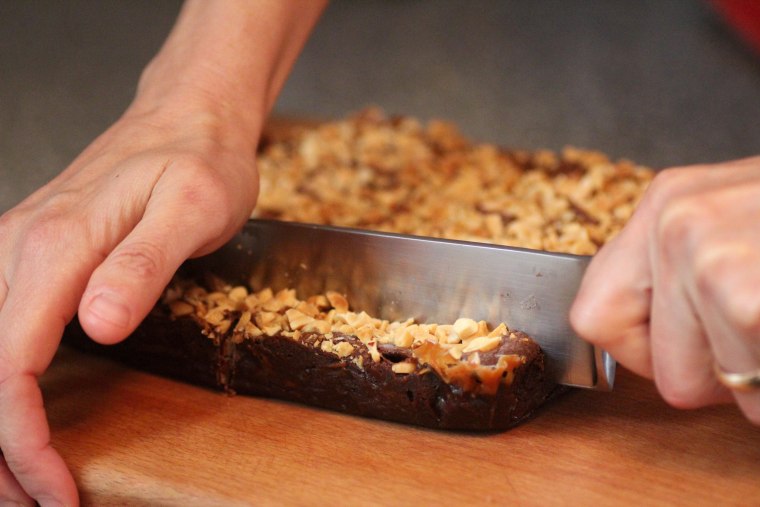 Cutting Halloween candy brownies