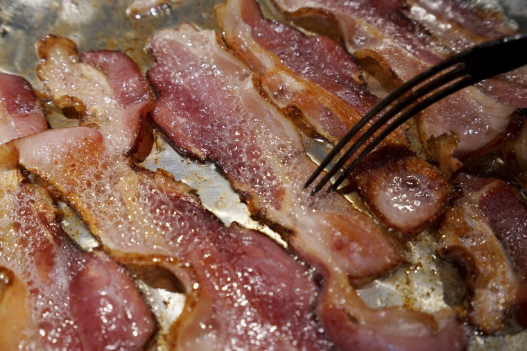 Image: Photo illustration of bacon is fried up in a pan in a kitchen in Golden