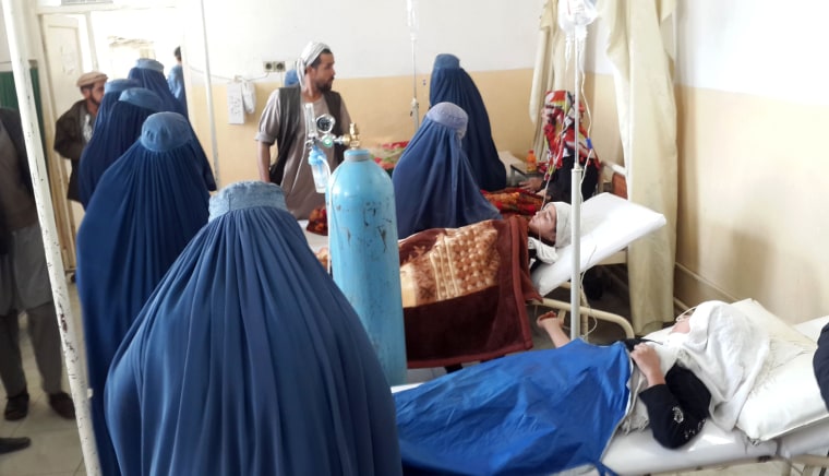 Image: Afghan school girls are treated at a hospital after an earthquake in Takhar province