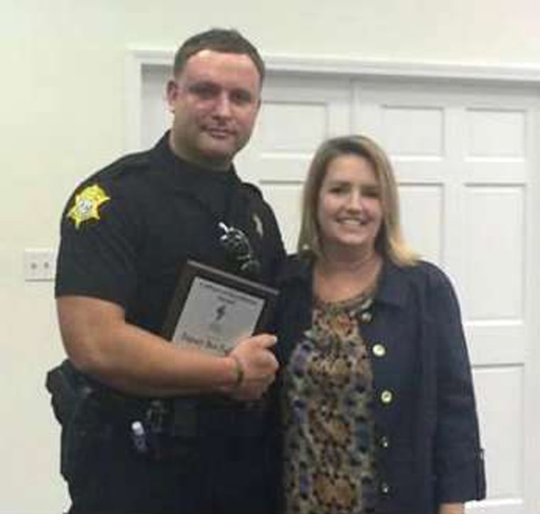 Image: Richland County Sheriff's Department Officer Senior Deputy Ben Fields is pictured with Karen Beaman, Principal of Lonnie B. Nelson Elementary School in Columbia South Carolina