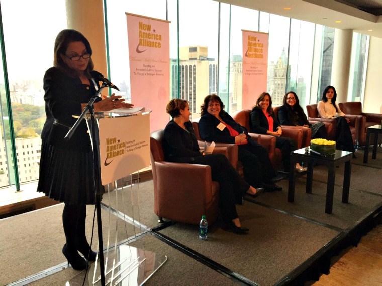 Ana-Maria Fernandez-Haar, NAA Latina Caucus Co-Chair (at podium) leads a panel of Latina leadership and economic force.