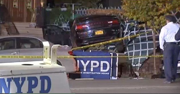 Police respond at the scene where a car careened on to the sidewalk in the Bronx, killing three people.