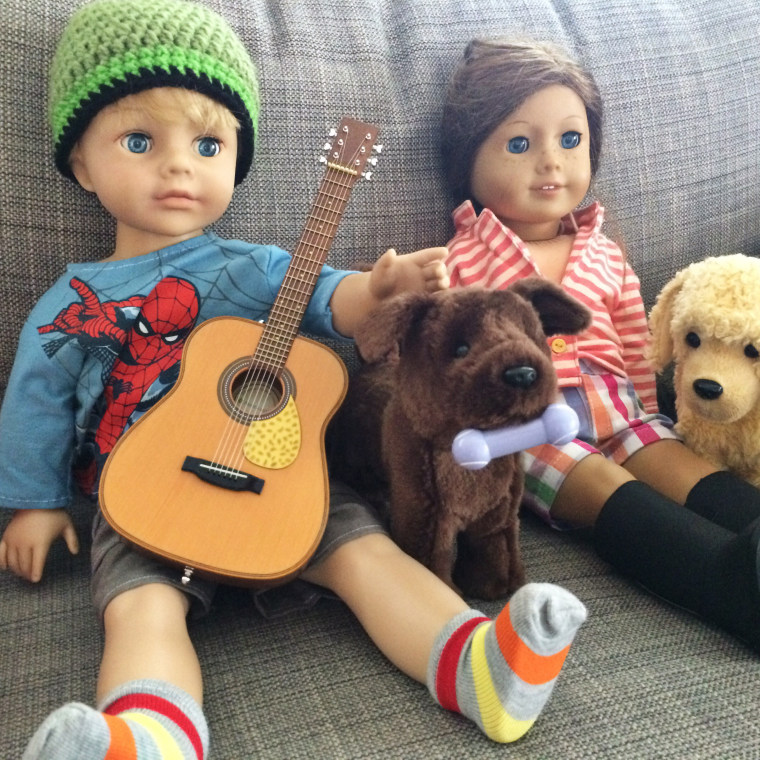 Miles' new "American Boy" doll is pictured with his sister Bronwynn's American Girl doll.