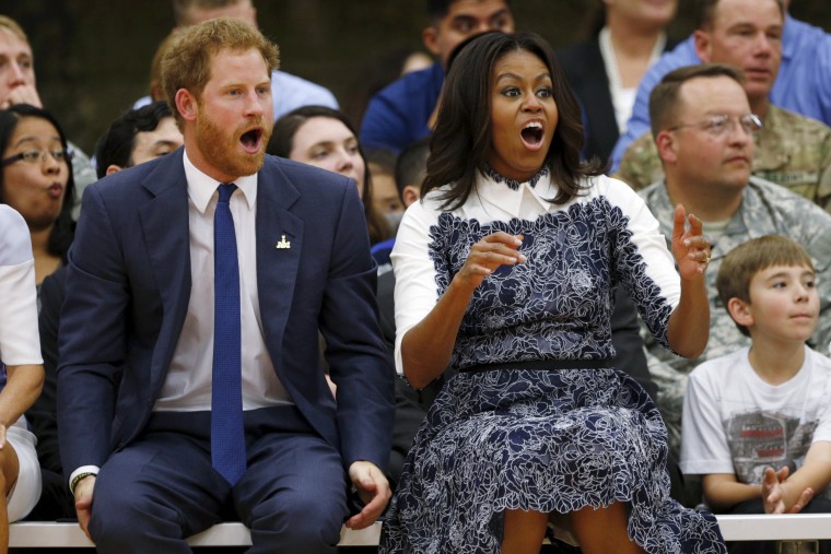 Image: Britain's Prince Harry and first lady Michelle Obama