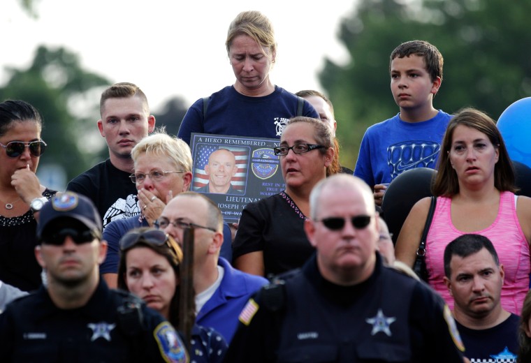 Image: Mourners attend a vigil at Lakefront Park to honor the memory of Fox Lake Police Lt. Charles Joseph Gliniewicz