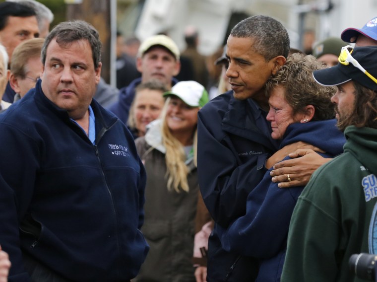 Image: U.S. President Barack Obama hugs marina owner after it was destroyed by Hurricane Sandy in New Jersey