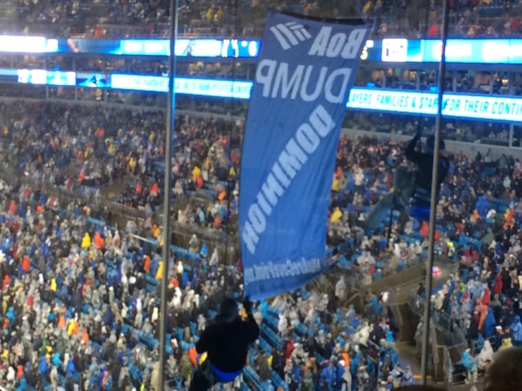 IMAGE: Anti-fracking protest at NFL game