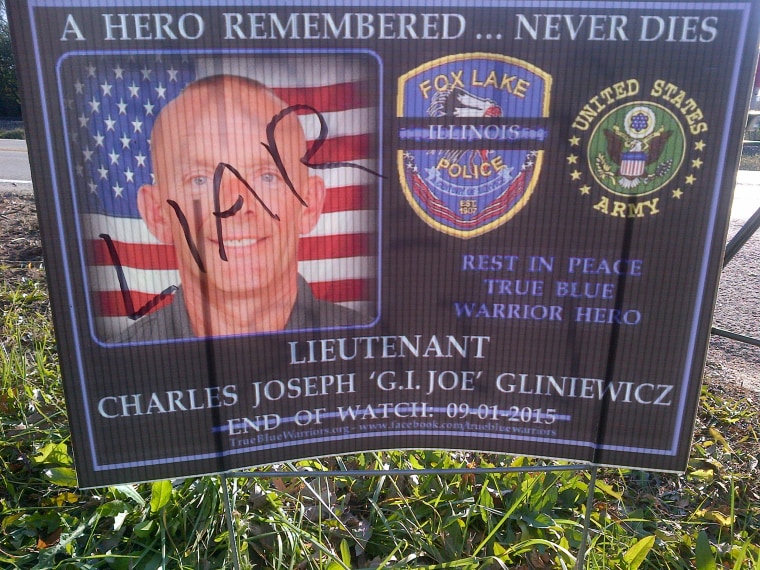 Image: Someone wrote "liar" on a poster honoring Lt. Joseph Gliniewicz.