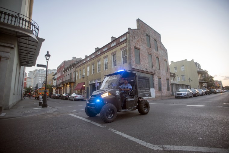 An off-duty NOPD officer working on the French Quarter Task Force patrols the French Quarter in New Orleans on May 6, 2015.