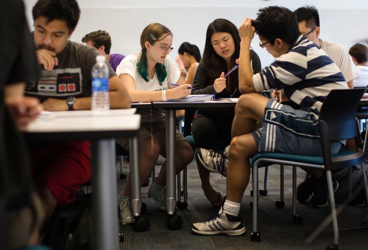 Image: Students work in a group to problem solve during a chemical and thermal processes class at Harvey Mudd College