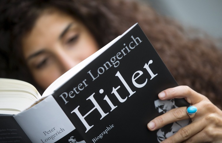Image: A woman reads Peter Longerich's new book "Hitler" in Berlin