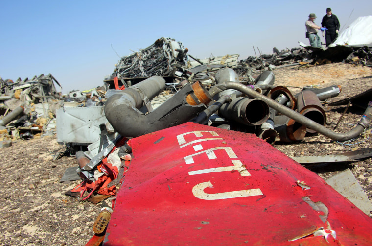 Image: Egyptian officials inspect the crash site 