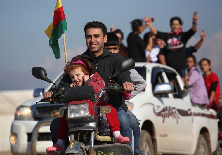 Image: Yazidi refugees in Syria celebrate
