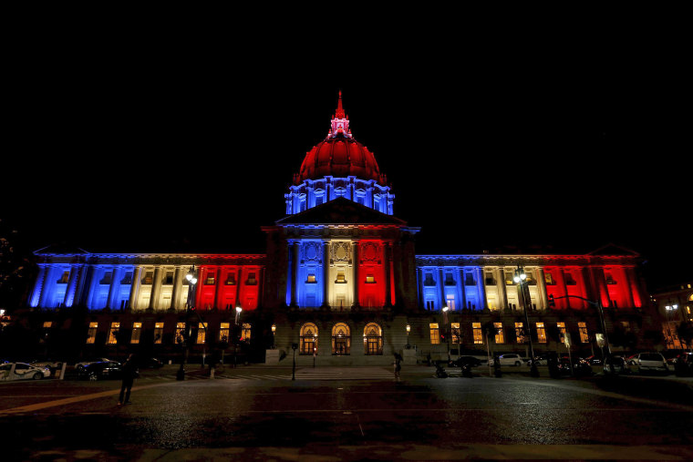 Image: San Francisco City Hall is lit up with blue, white and red, the colors of the French flag, following the Paris terror attacks, in San Francisco