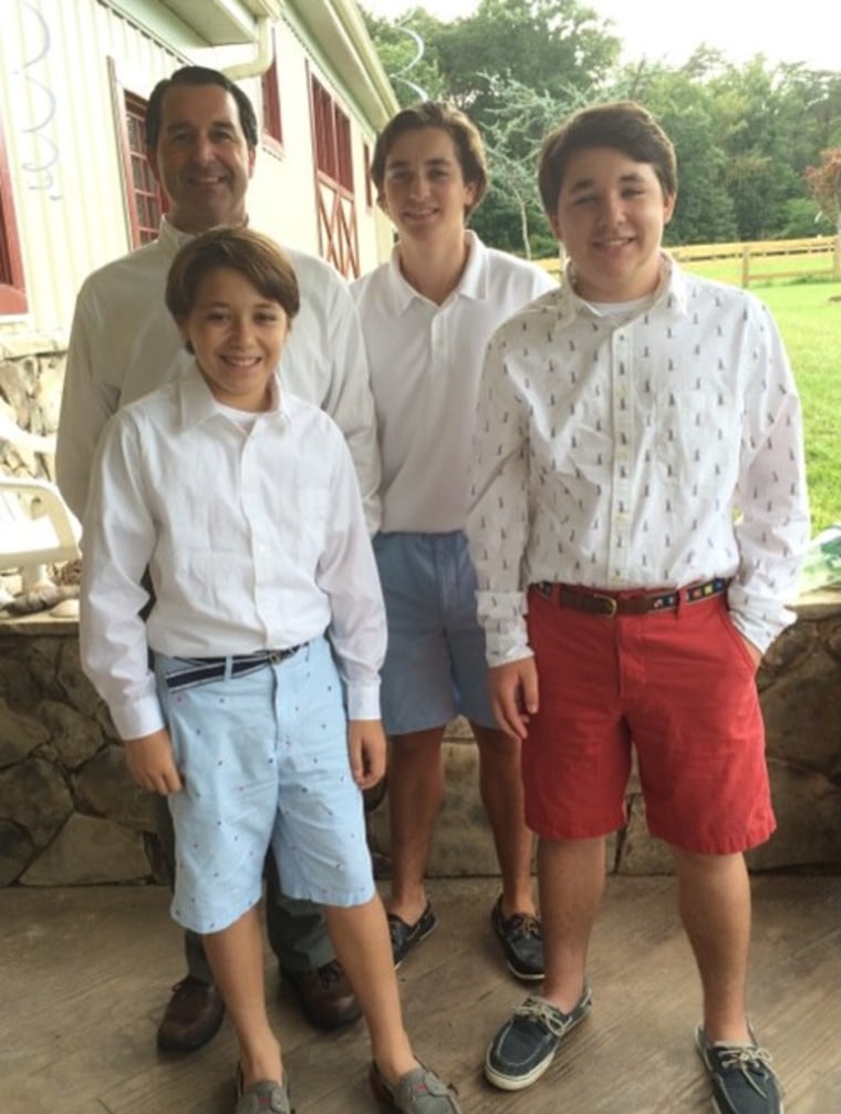 Three teen boys with their dad