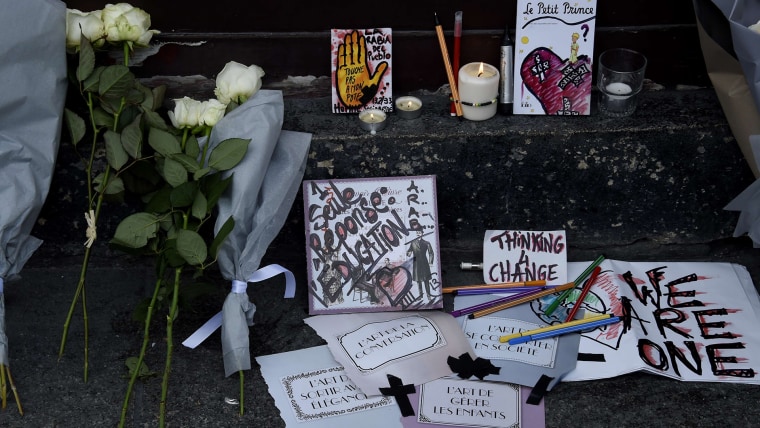 Tributes to victims of the attacks lie near the entrance to the Carillon restaurant in Paris on November 14, 2015 following a series of coordinated attacks in and around Paris late Friday which left more than 120 people dead.