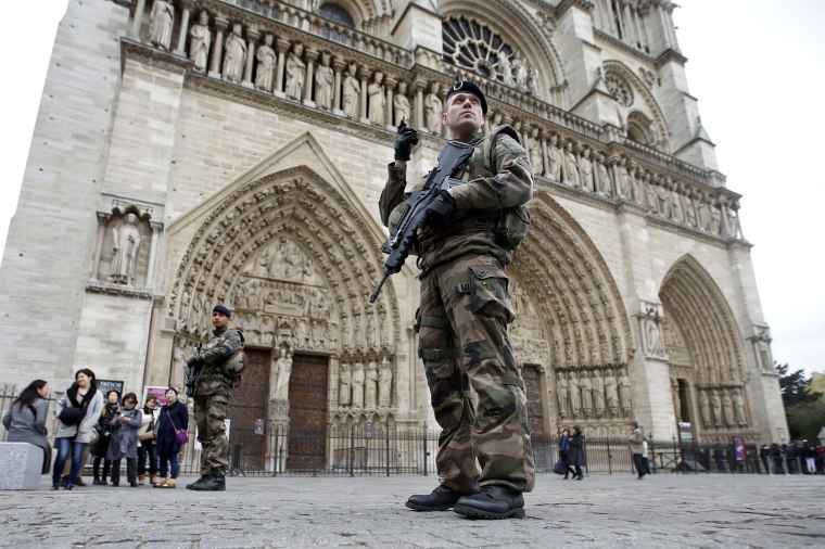 Image: Soldiers patrol in front of the Notre Dame Cathedral in Paris after last Friday's series of deadly attacks in the French capital