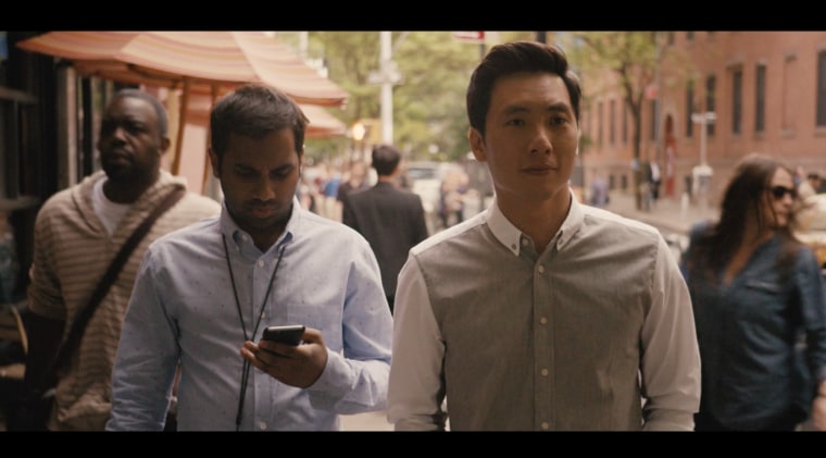 Dev (played by Aziz Ansari, left) and Brian (played by Kelvin Yu, right) discuss their parents in a scene from Netflix's "Master of None."