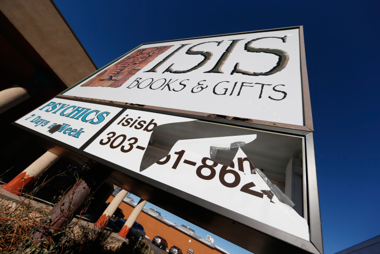 Image: A sign outside Isis Books and Gifts store is broken