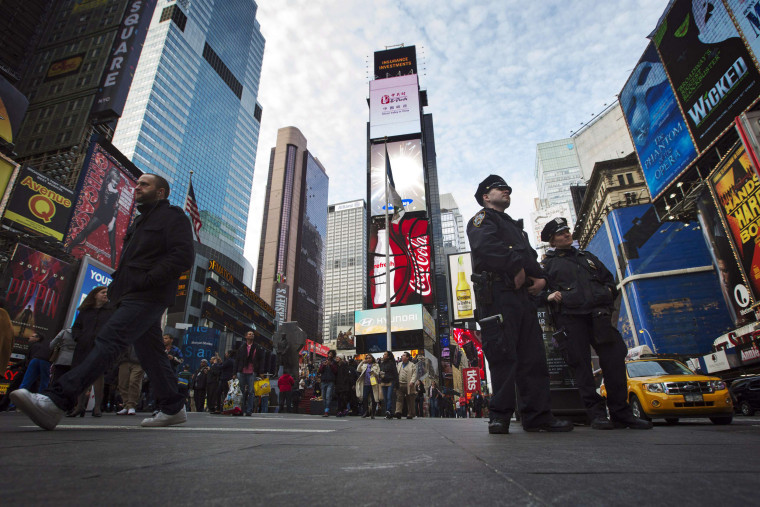 Image: NNew York Police Department officers stand in the Times Square district of New York during an increase in security