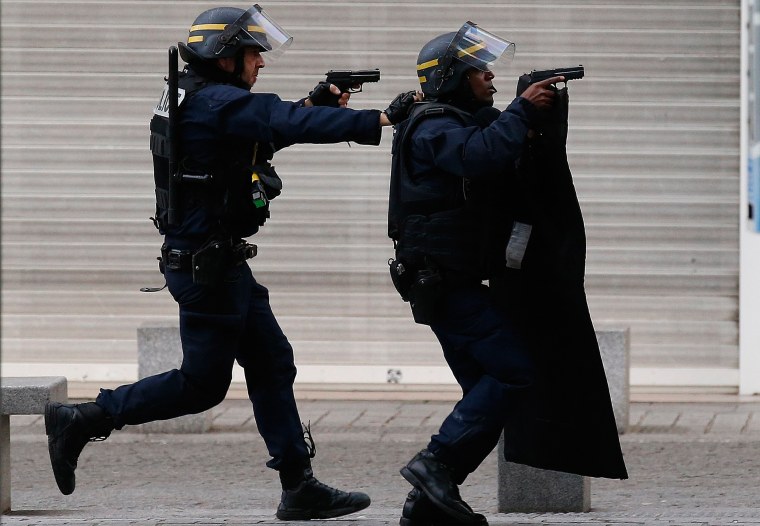 Image: Police forces operate in Saint-Denis