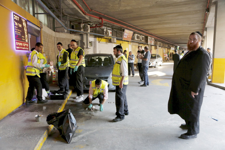 Image: Zaka emergency personnel work at the scene of a Palestinian stabbing attack in Tel Aviv, Israel